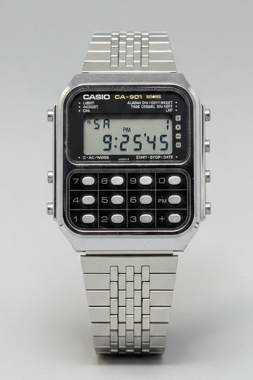 Casio digital watch on a blue background