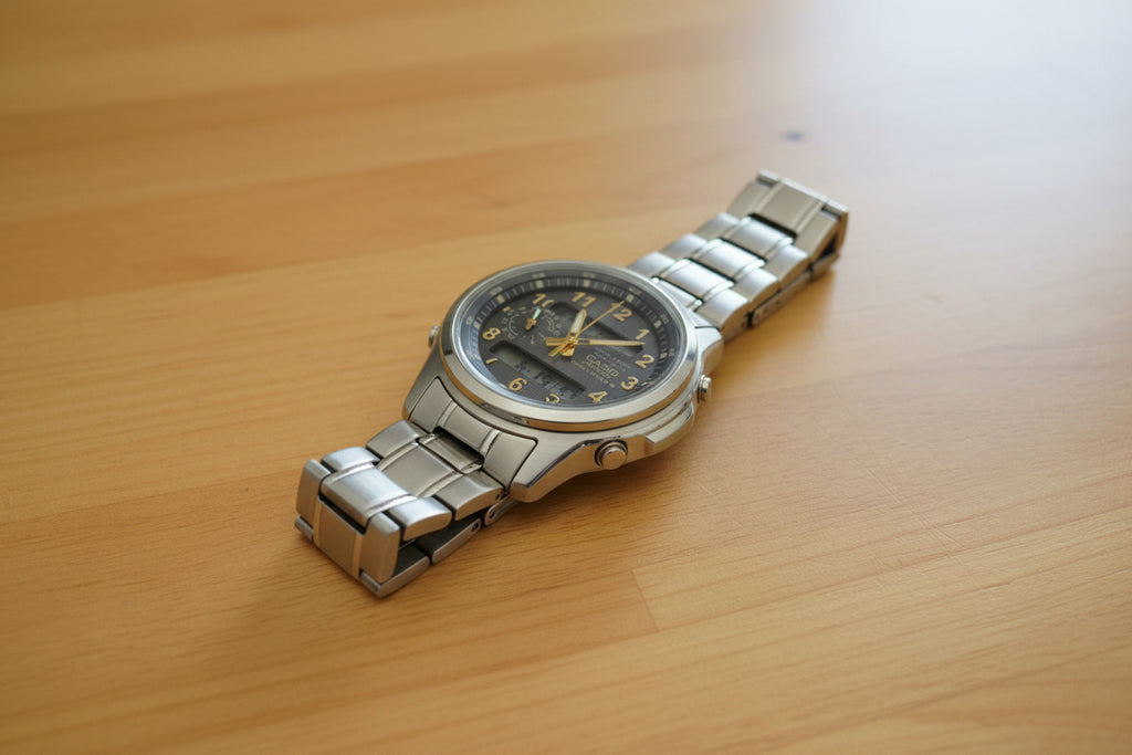 Silver Casio watch on a dark background with a Casio logo.