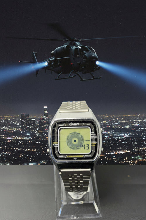 Digital watch with Casio logo on a dark background