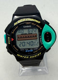 Digital watch with green and black casing on a white background