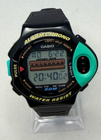 Digital watch with green and black casing on a white background