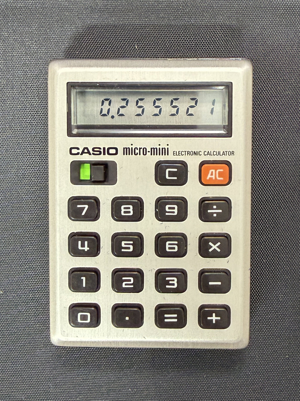 Casio Micro-Mini M-800 is a historic, pocket-sized calculator from 1976 Japan.